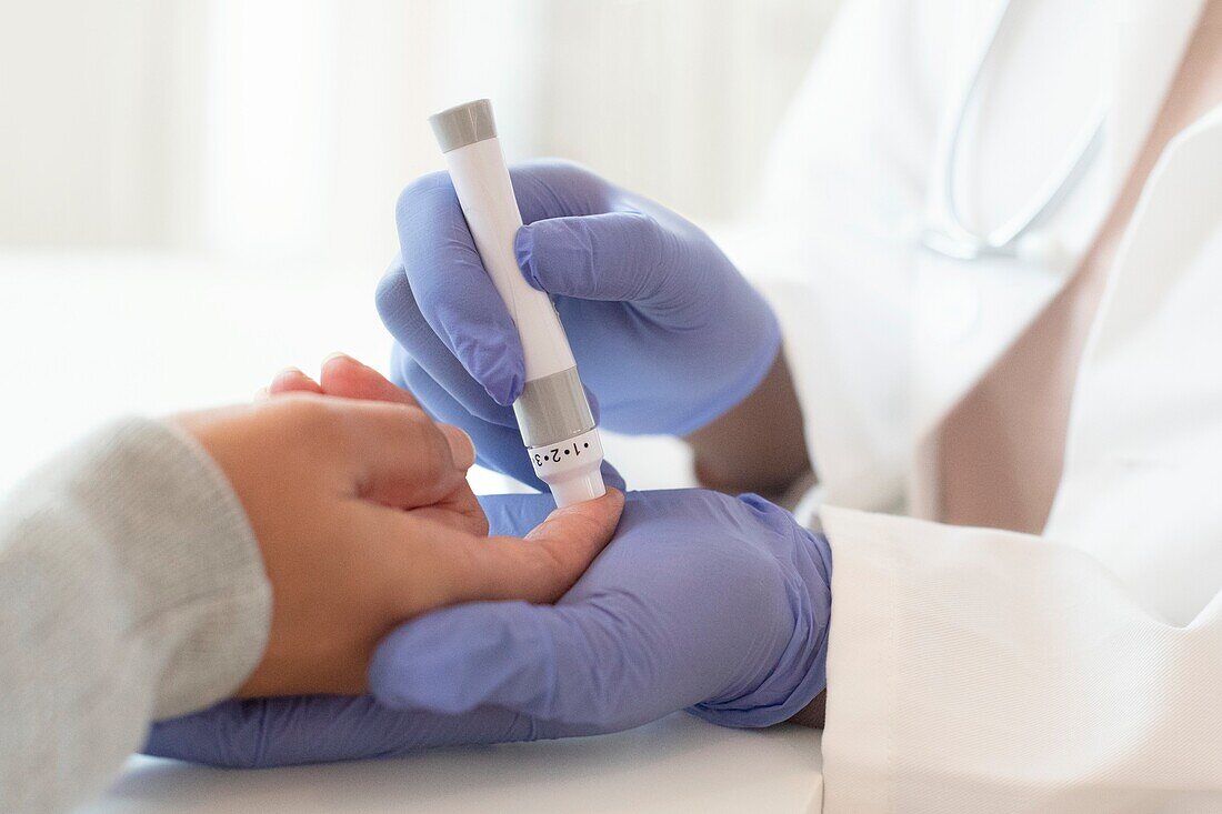 Taking finger prick blood sample
