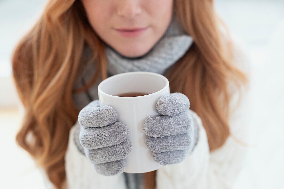 Woman holding a hot drink