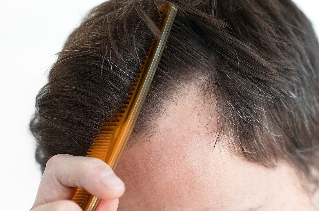 Man combing his hair