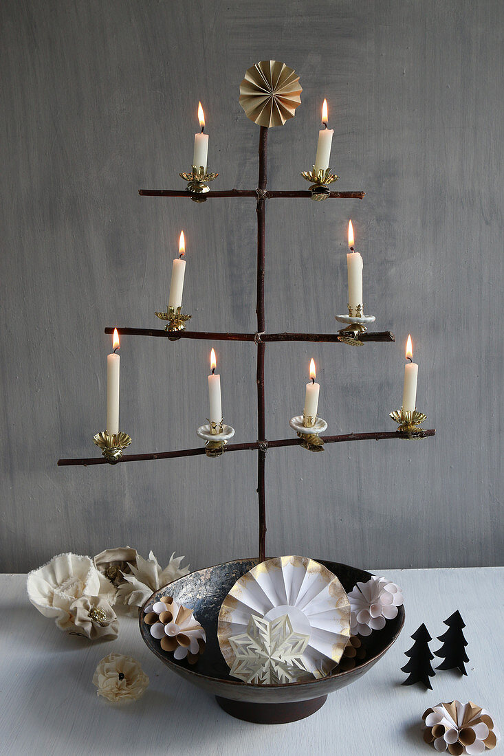 DIY, stylised Christmas-tree arranged in metal bowl against grey wall