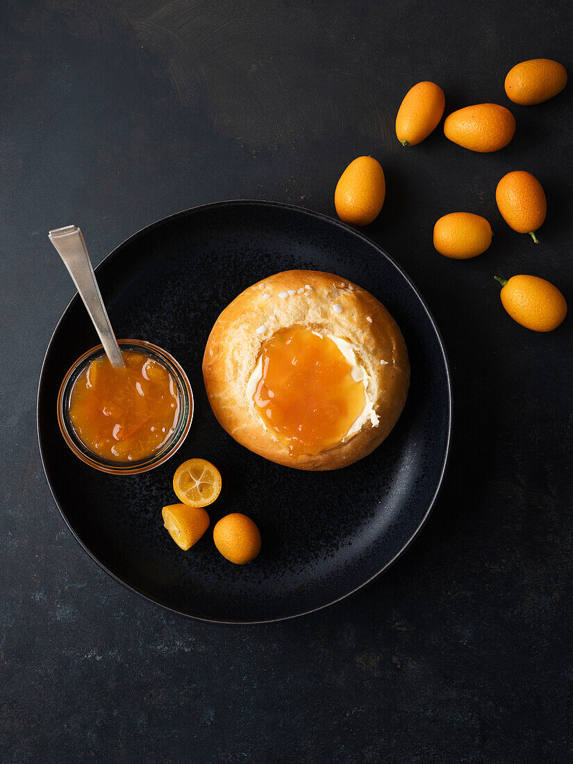 Kumquat jam on a bread roll