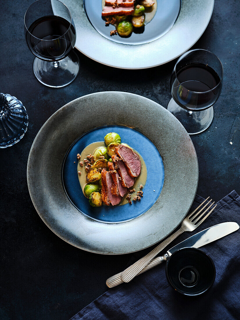 Pink roasted duck breast with Brussels sprouts and sesame miso sauce