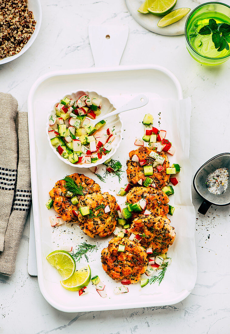 Quinoa and salmon trout patties with cucumber and radish salsa