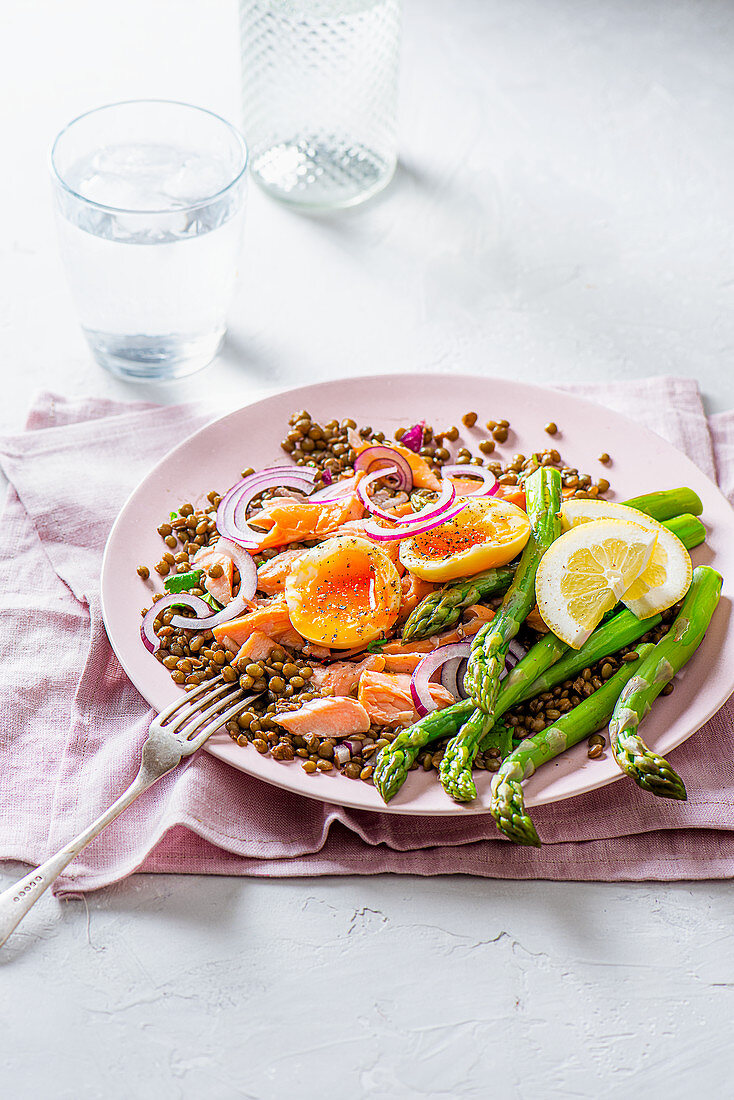 Summer lentil and salmon salad with asparagus and soft boiled egg