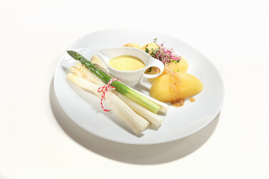 Green and white asparagus with potatoes and hollandaise sauce