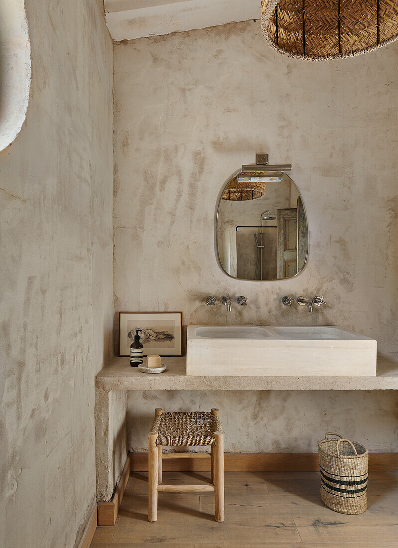 sink with countertop in a bathroom with neutral colored walls