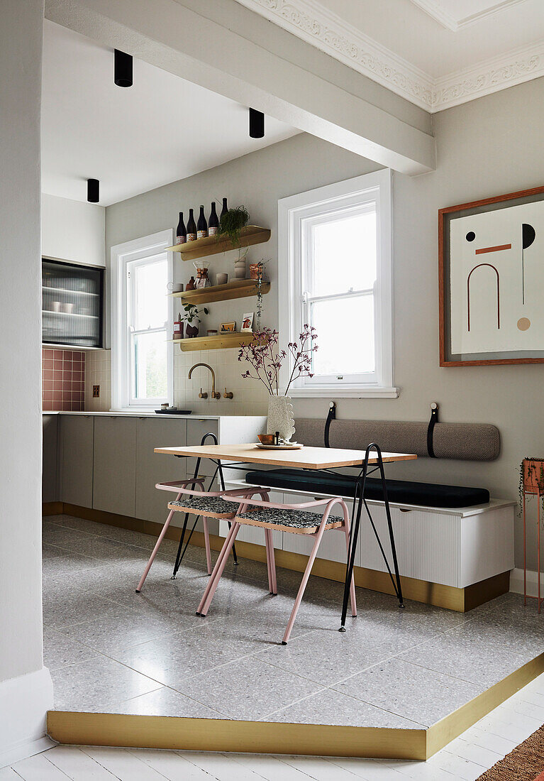 Filigree table with chairs and bench in contemporary kitchen