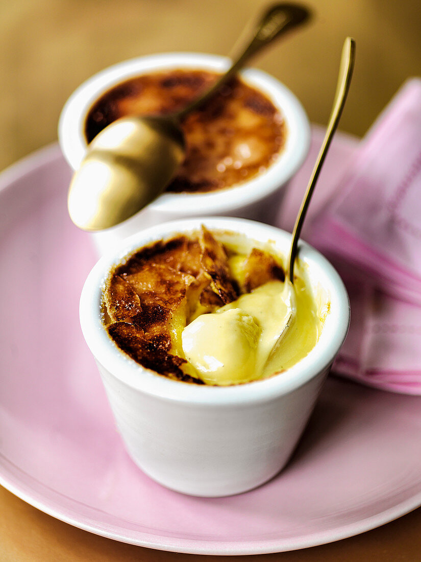 Creme Brulee with gold spoons and pink napkins