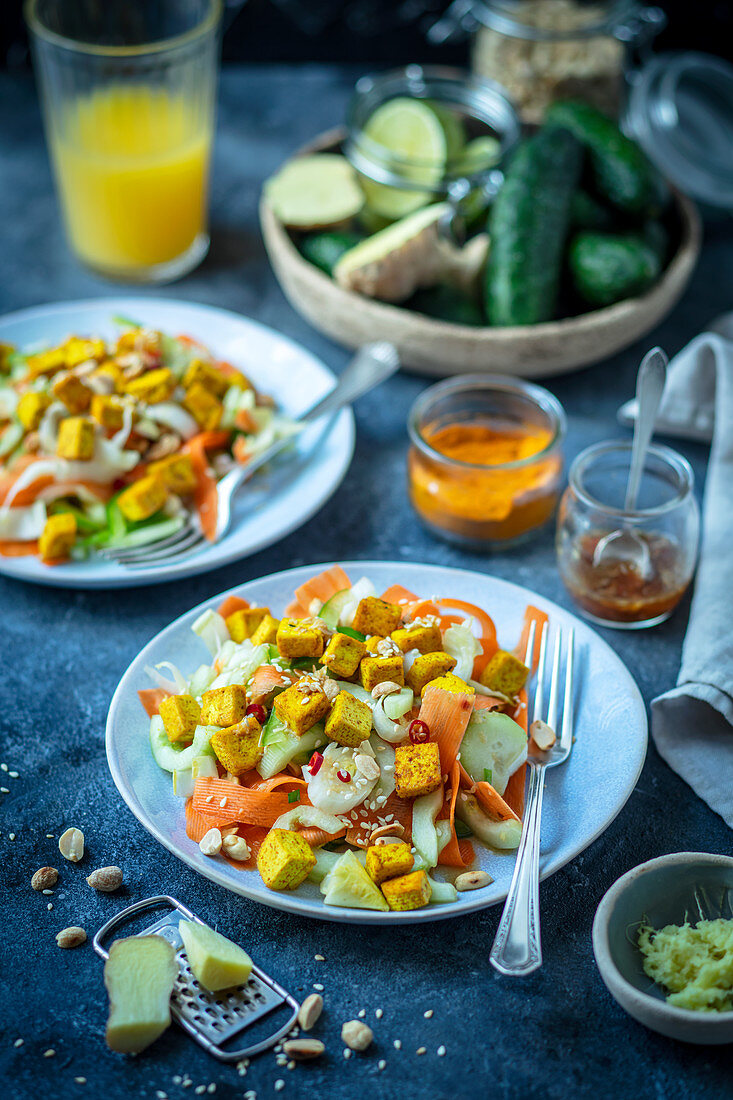 Cucumber and carrot salad with curried fried tofu