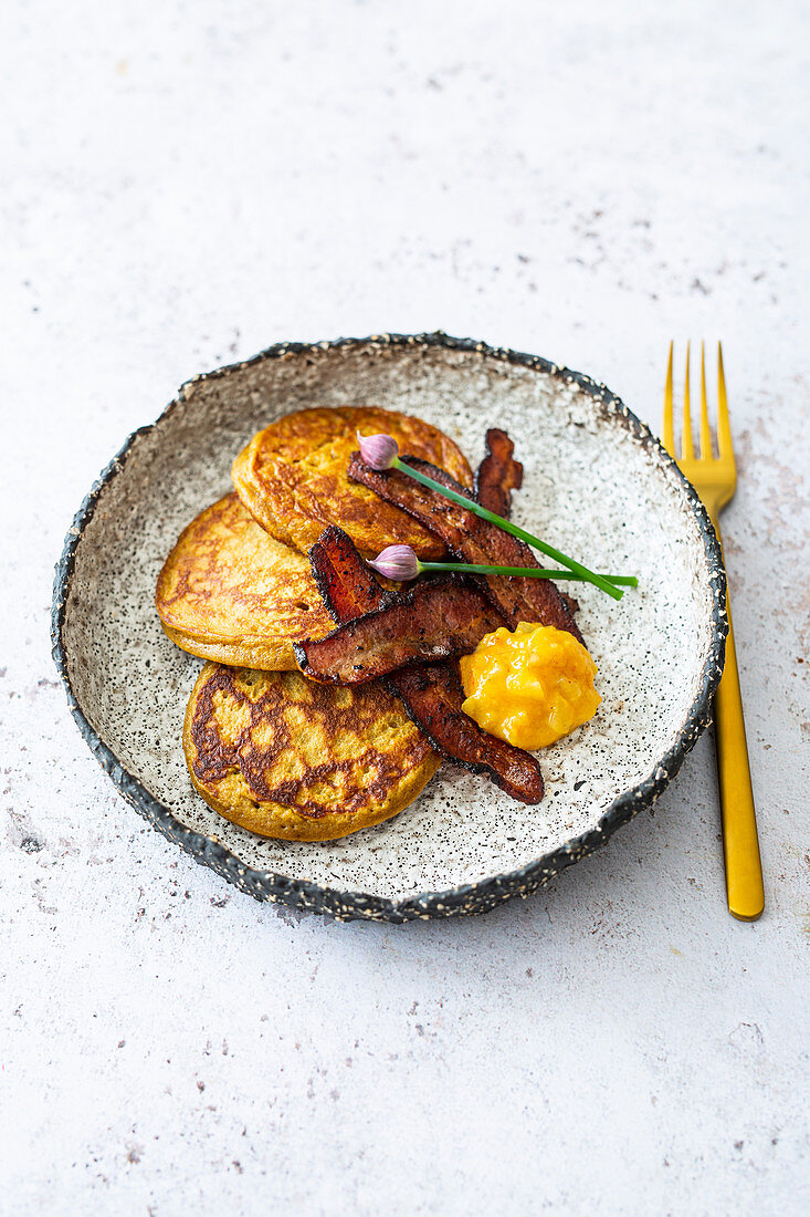 Gluten-free sweet potato pancakes with bacon and pear and mango chutney