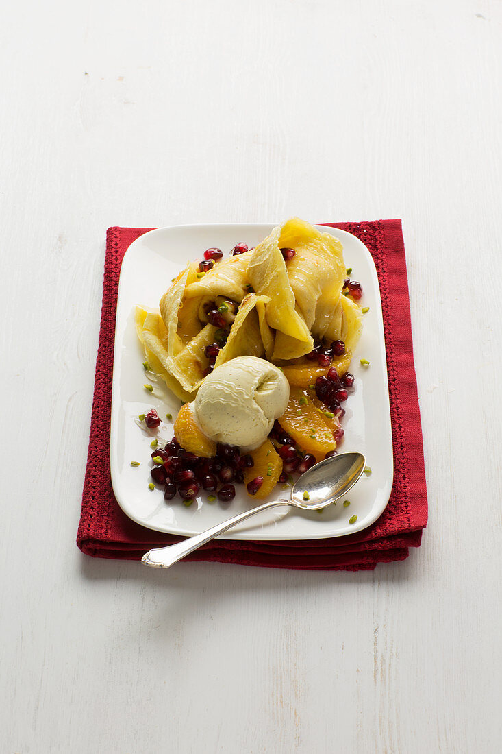 Oriental crêpes with ice cream, exotic fruit salad and honey