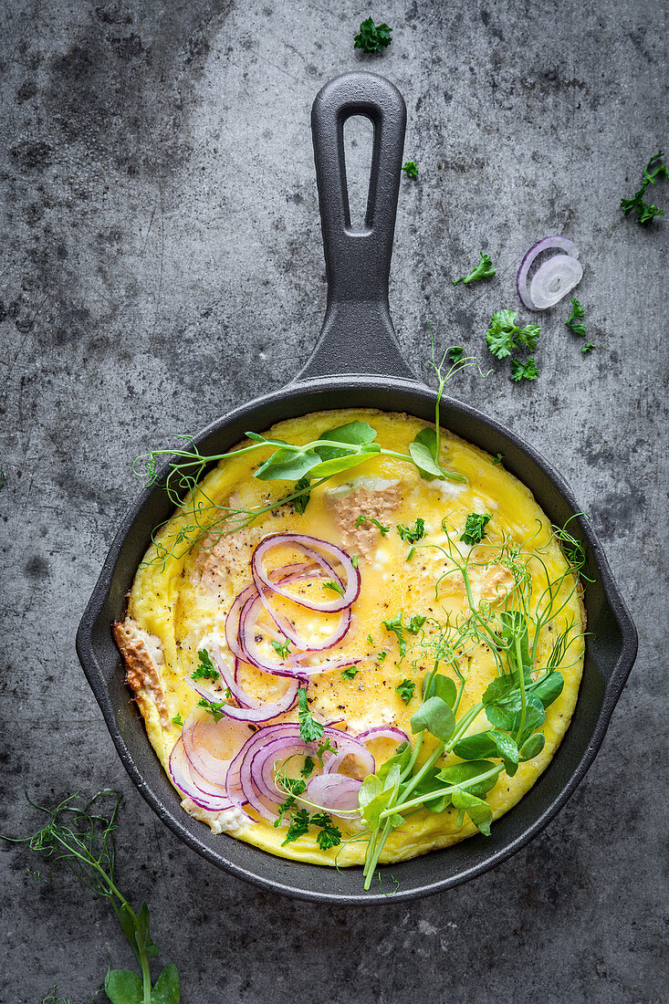 Omelette with cottage cheese, onions and pea shoots