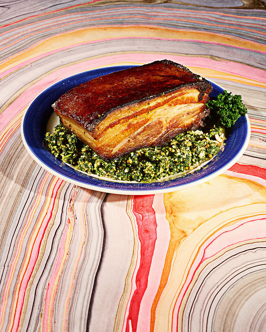 Pork belly with kale hazelnut pesto