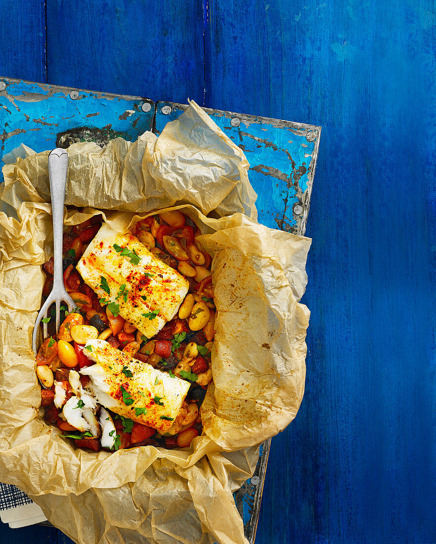 Bag-baked cod with tomatoes, chorizo and butterbeans