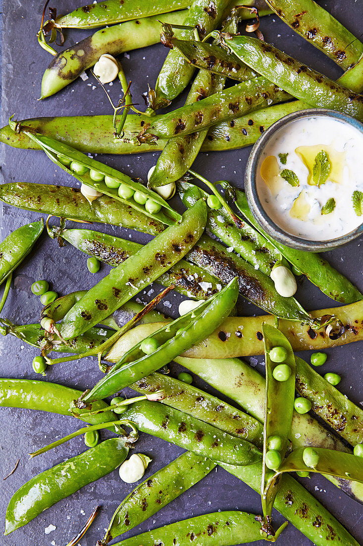 Grilled peas and broad beans with a minted yogurt sauce