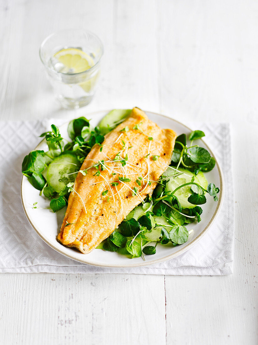 Brown butter trout with cucumber and cress