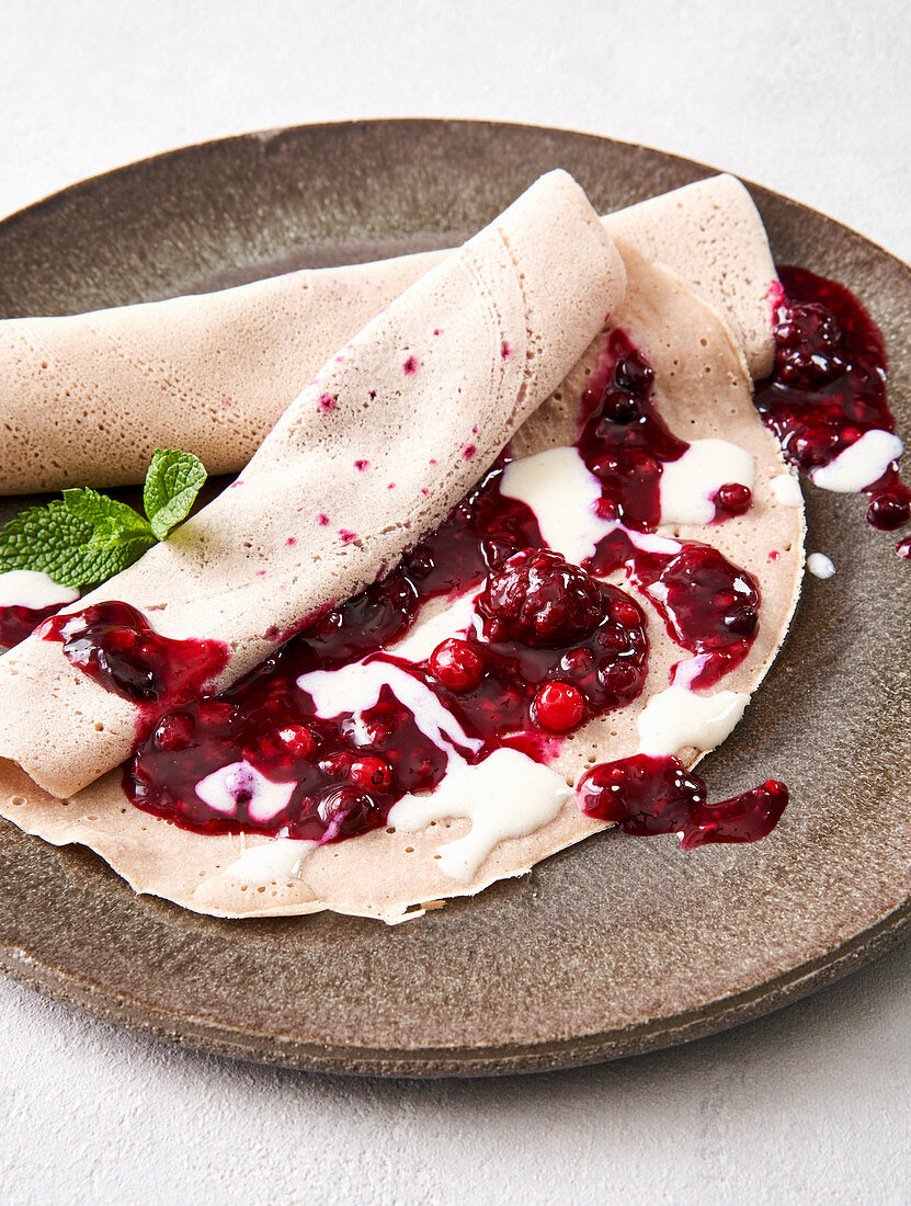 Buckwheat crepes with wild berries and yogurt cream (vegan)
