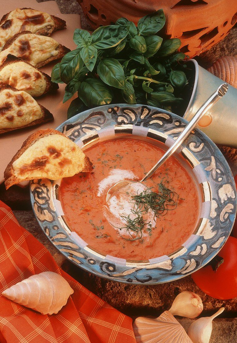 Tomato soup with sour cream, basil & toasted cheese croute