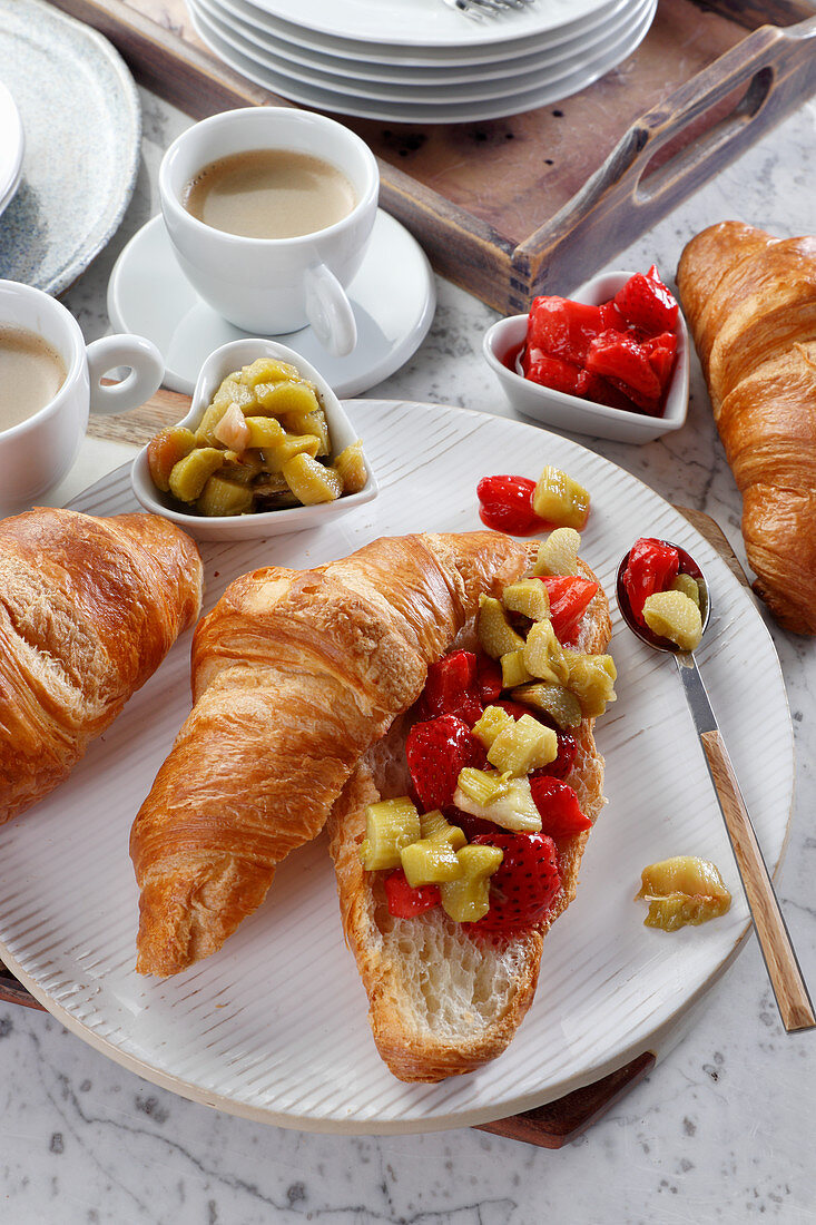 Breakfast croissant with rhubarb mousse and strawberries