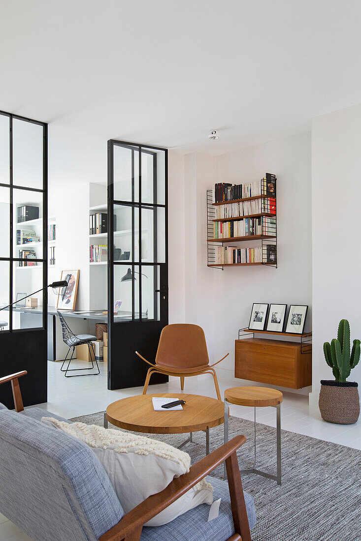 Coffee table and seating in the living room, study in the background