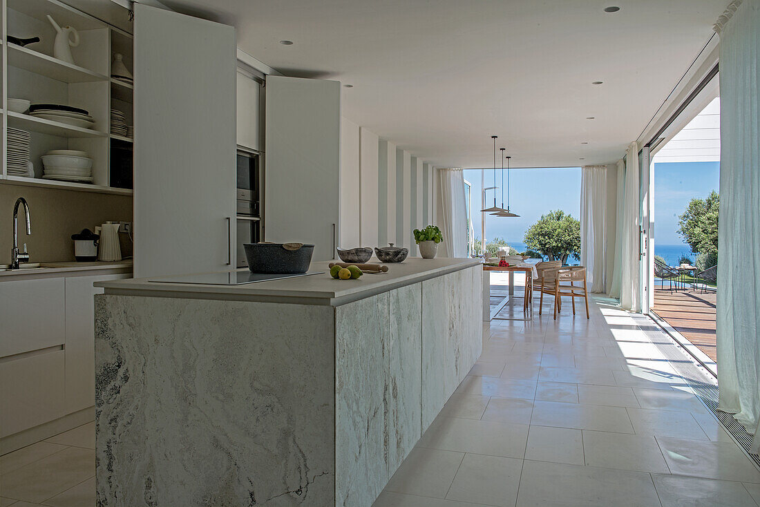 Marble island counter in fitted kitchen