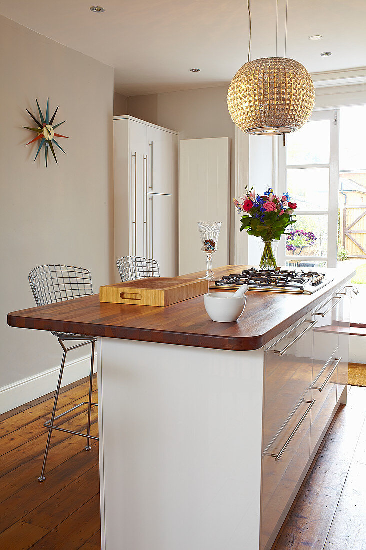 White kitchen counter with wooden worktop