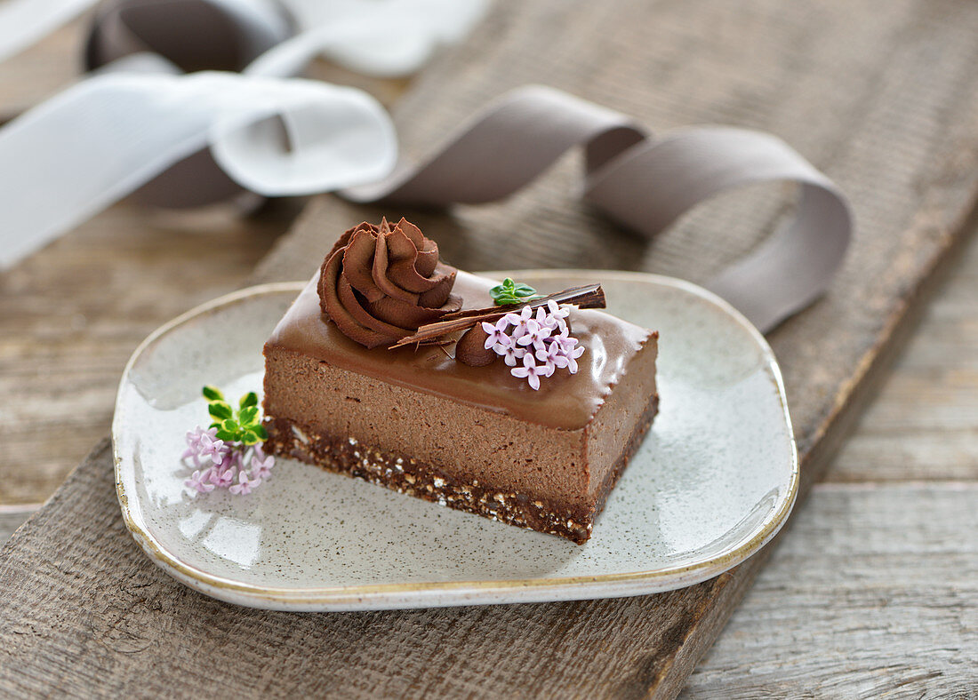 Raw vegan chocolate mousse cake with oat and date crust and creamy ganache