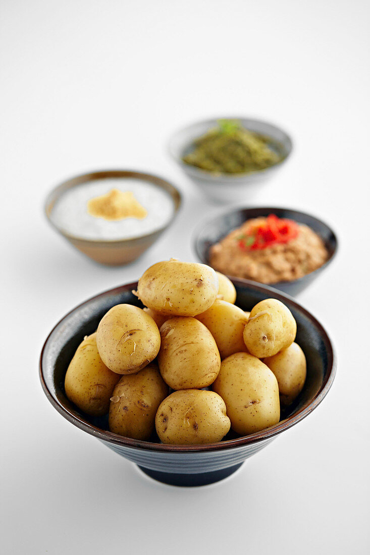 Boiled potatoes with various sauces and dips