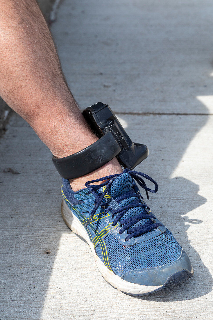 Man wearing an electronic monitoring device