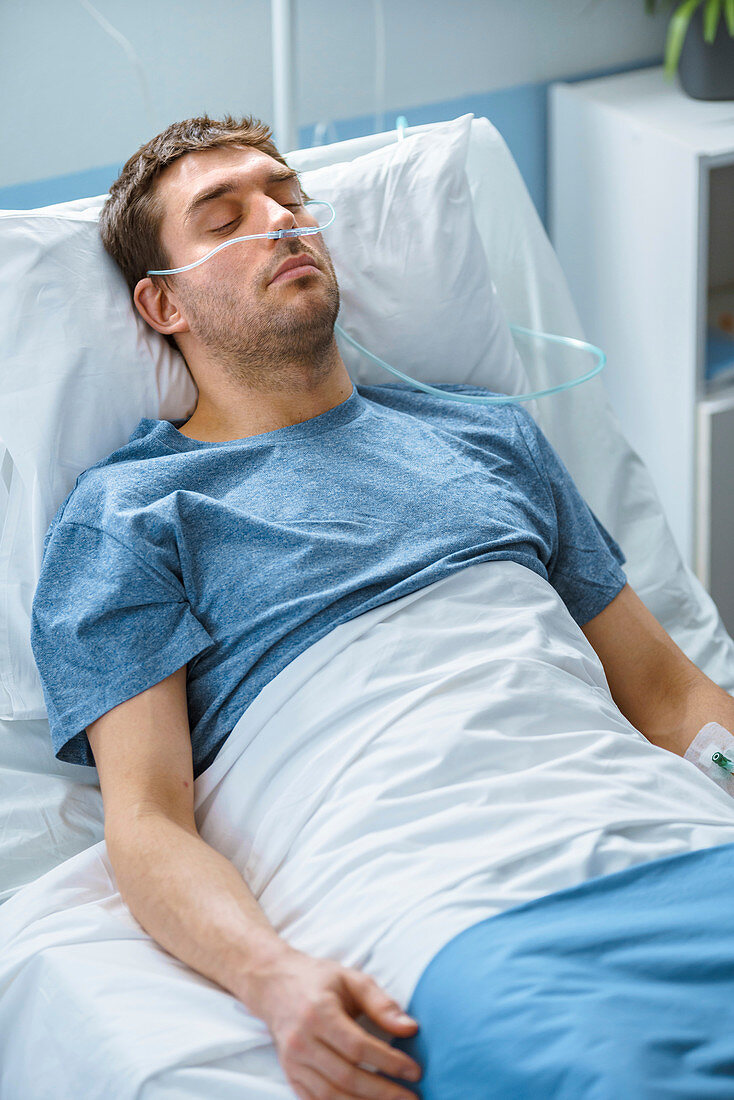 Sick patient sleeping in a hospital bed