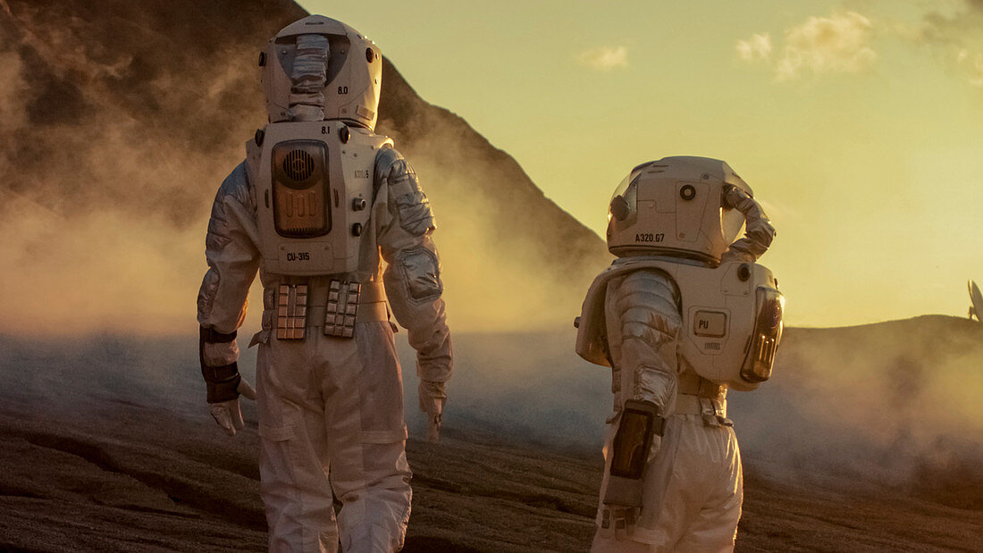 Two astronauts walking on alien planet