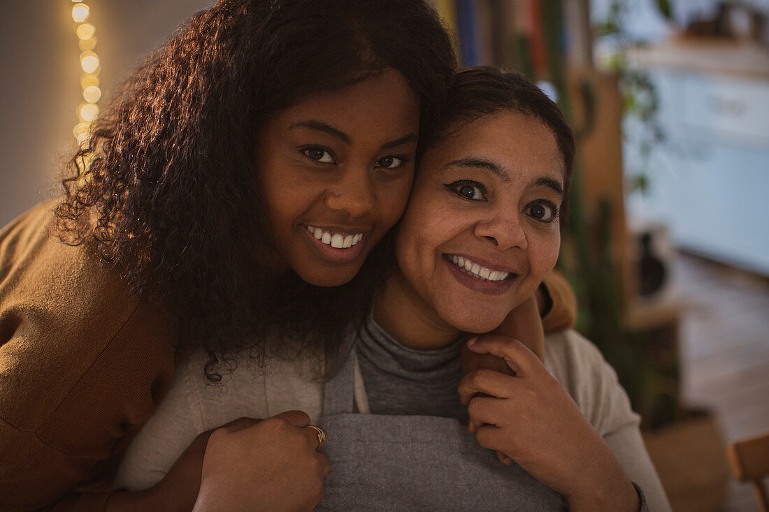 Happy mother and daughter hugging