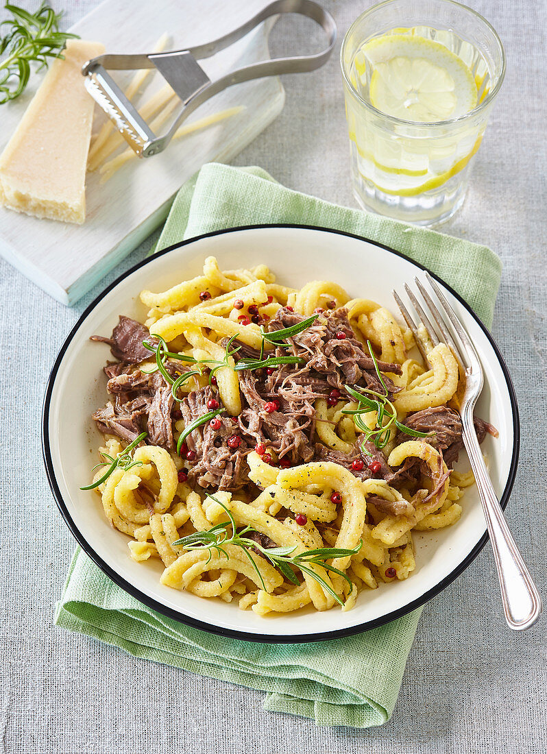 Pasta with beef meat and rosemary