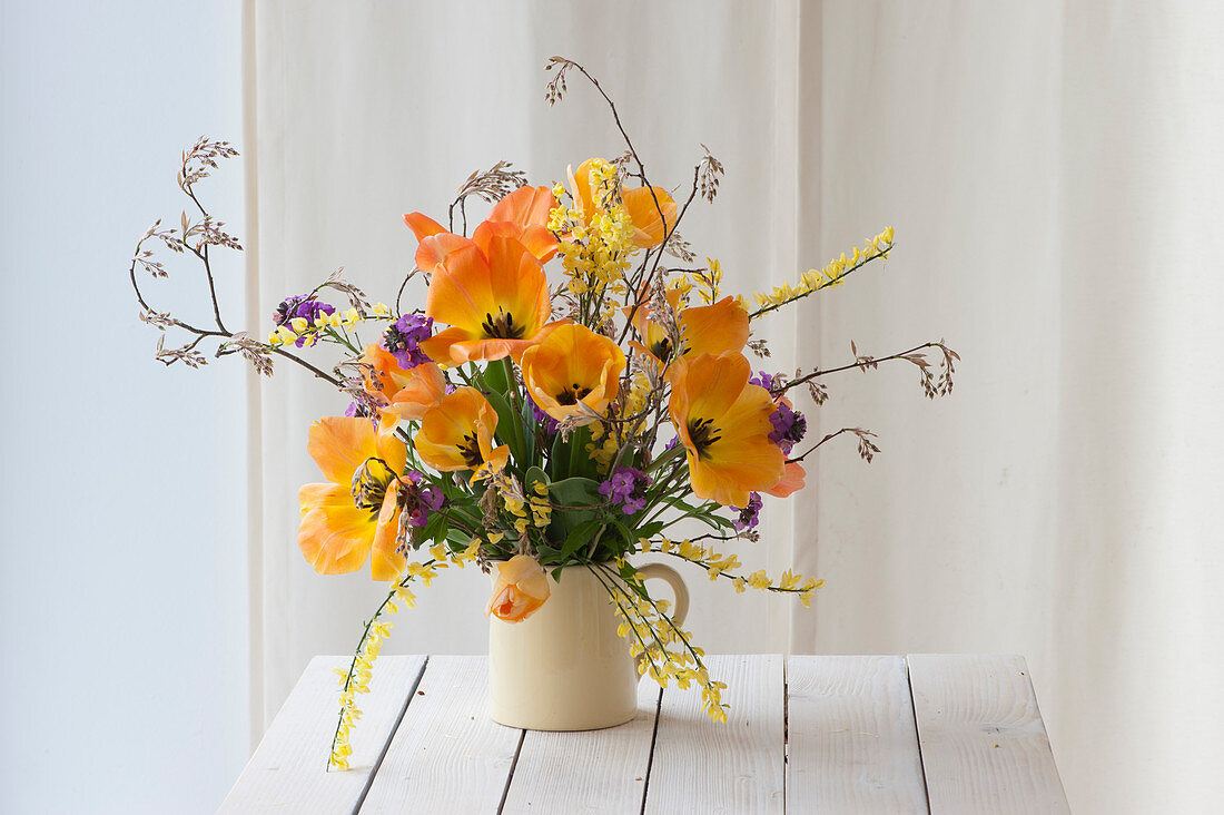 Spring bouquet with tulips 'Daydream', gorse, gold lacquer and rock pear