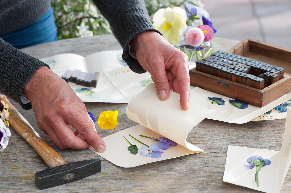 Design greeting cards with flowers: place pressed flowers in the center of the card