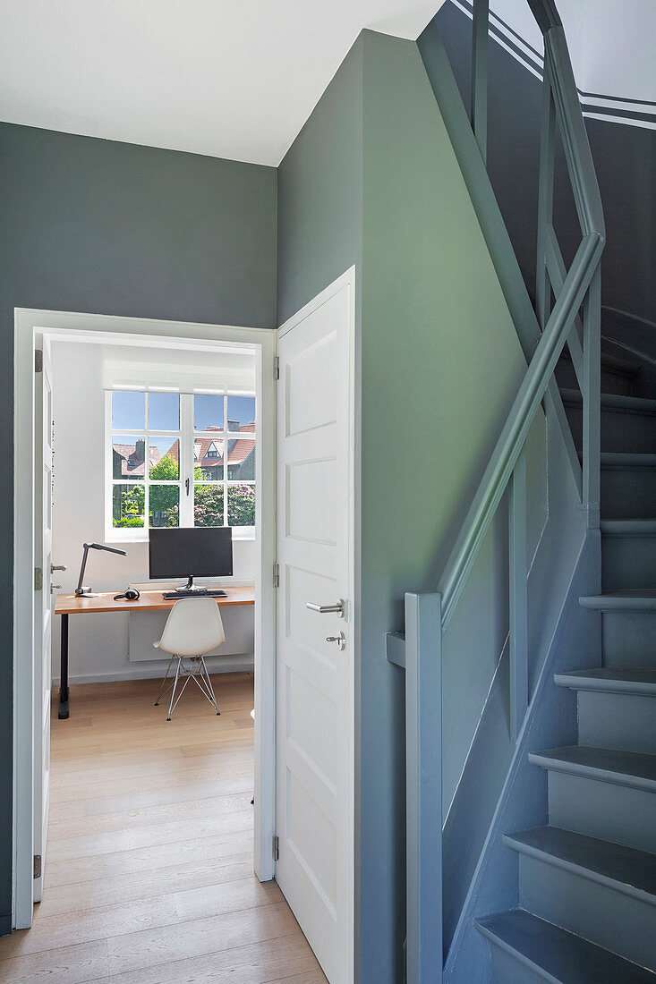 View past stairs in the hallway into the study