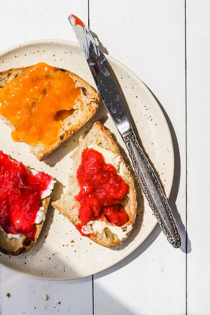 Slices of toast with jam and butter