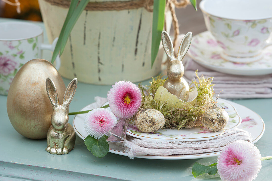 Easter plate with golden Easter bunny in eggshell on moss, Tausendschon Roses, golden Easter eggs, and quail eggs
