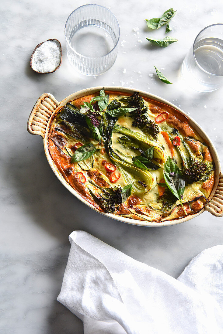 A spicy vegetable casserole on a marble backdrop