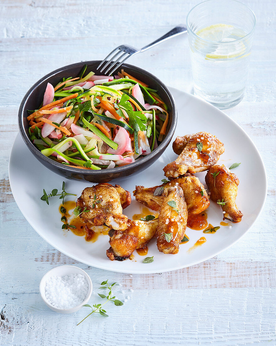 Chicken wings with zucchini salad