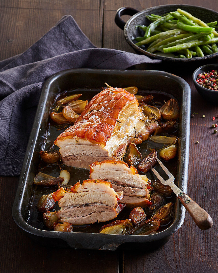 Juicy baked pork belly with green beans