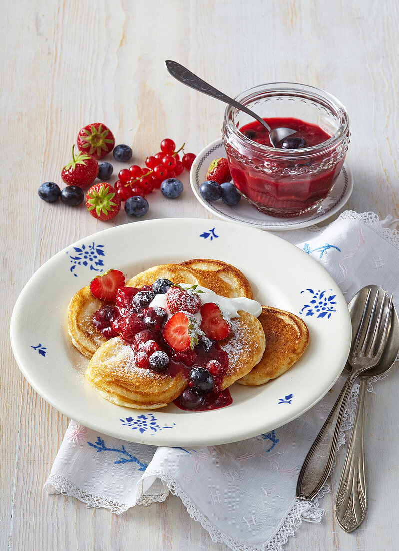 Pancakes with yoghurt and garden fruits
