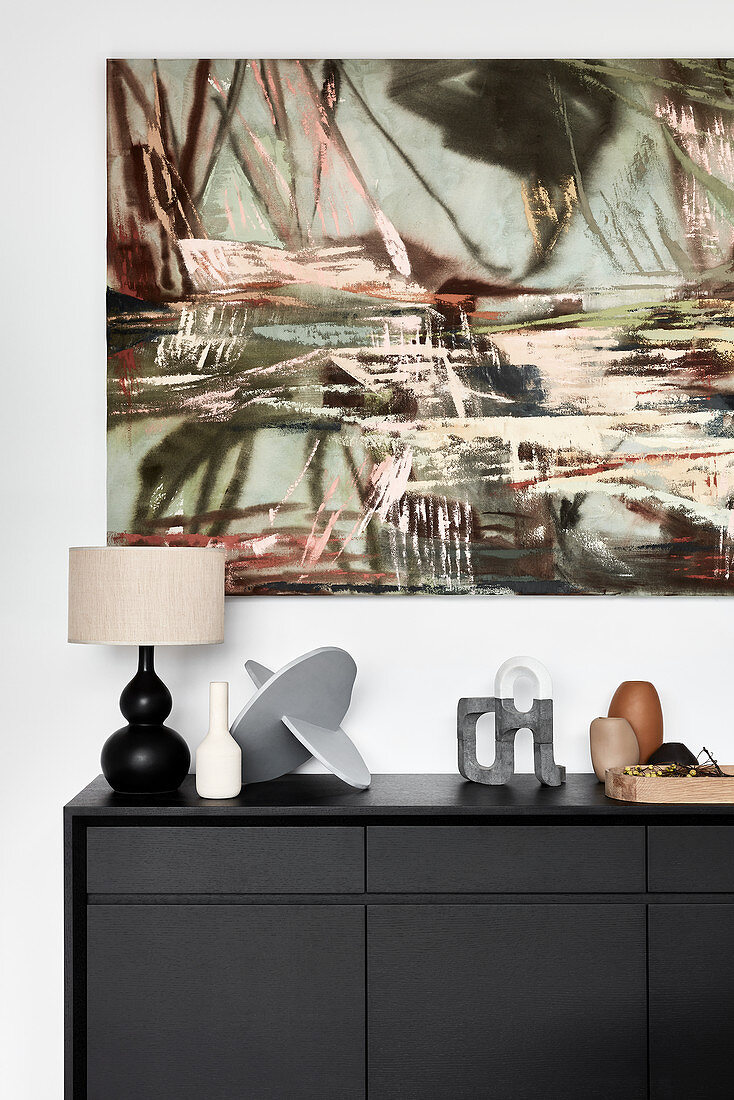 Modern artwork on wall above sideboard