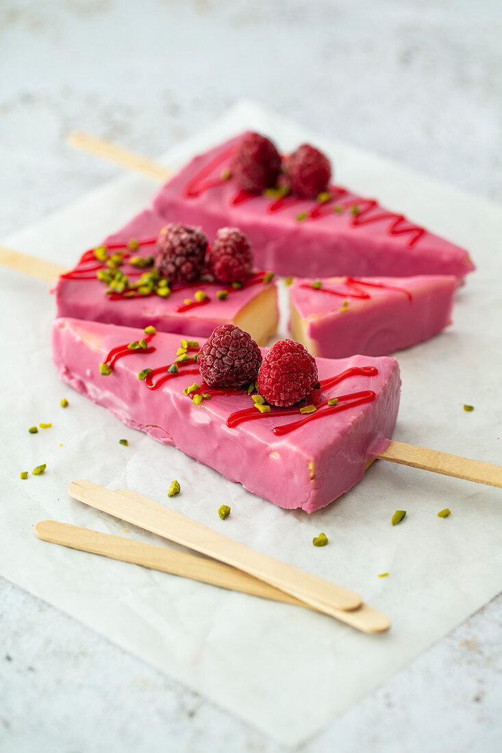 Cheesecake with raspberries on a stick