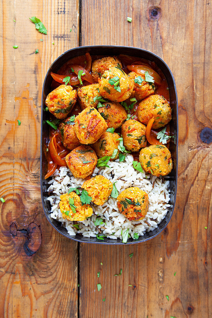 Lentil carrot balls in curry sauce with rice