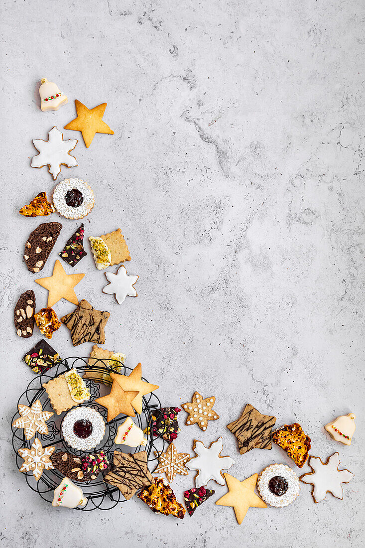Various Christmas biscuits arranged at the edge of the picture
