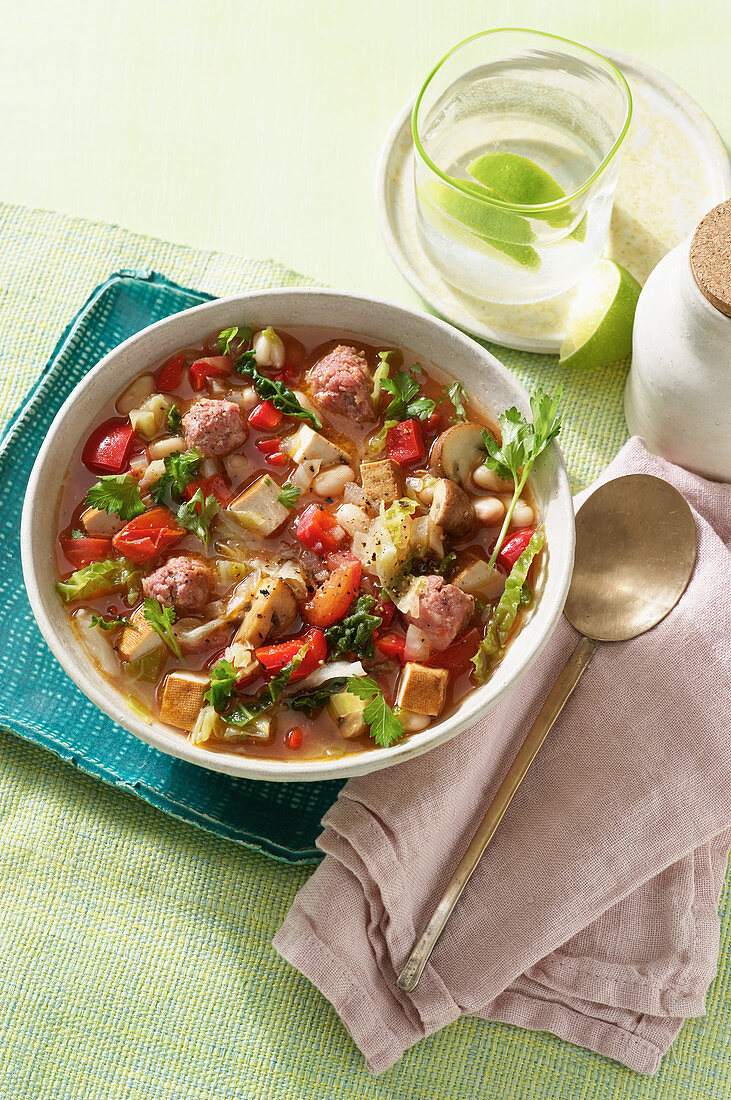 A hearty stew with tofu, beans and ground sausage