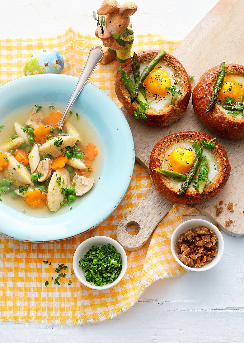 'Primavera' Chicken soup, served with baked asparagus egg nests