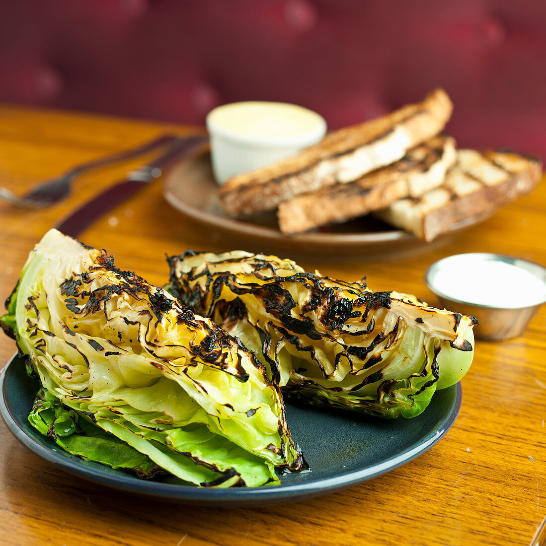 Char grilled lettuce head with toast and butter