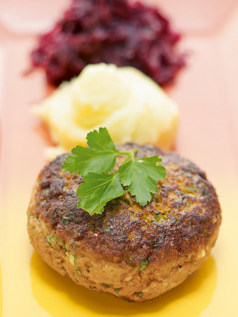 Mini meatloaf patty with red cabbage and puree